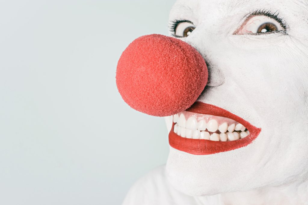 Red nose clown smiling